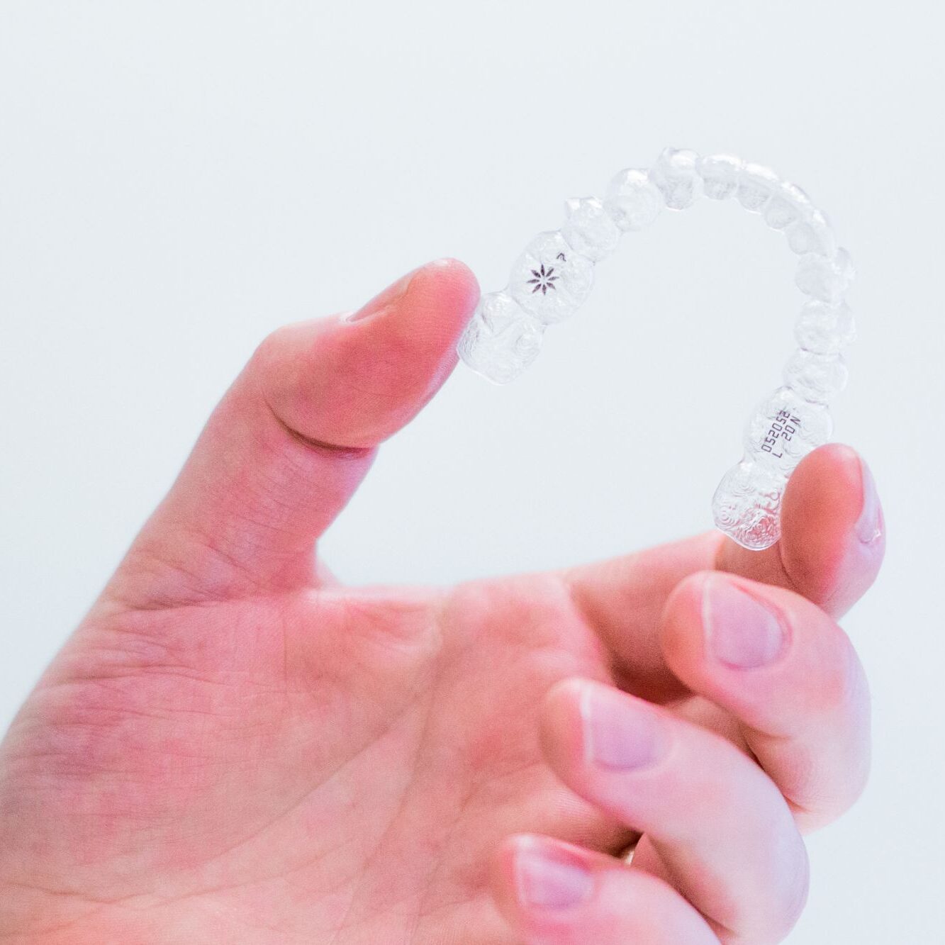hand-holding-invisalign-aligners invisalign henderson nv